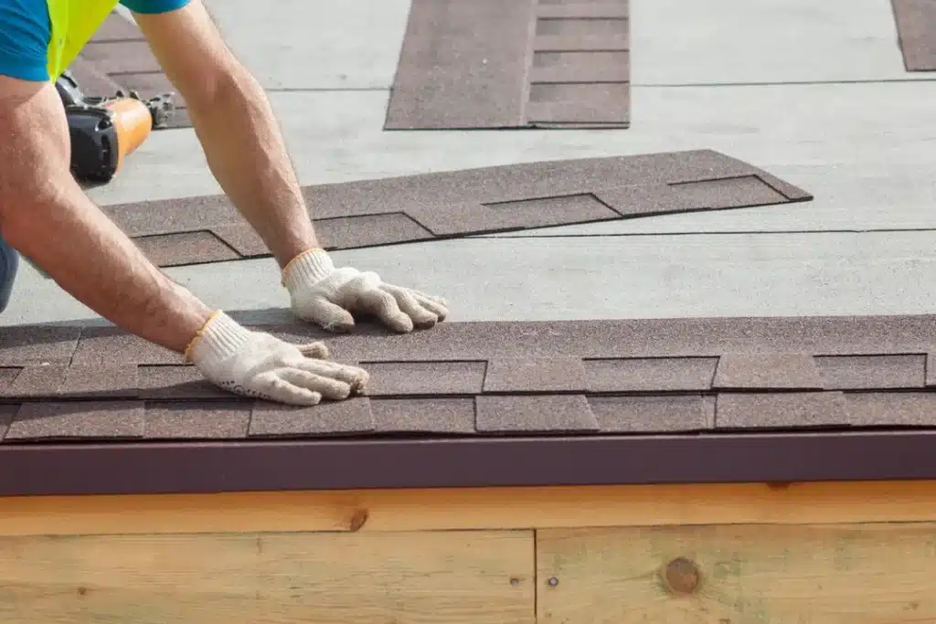 Worker installing roofing