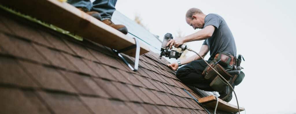 Workers installing roof